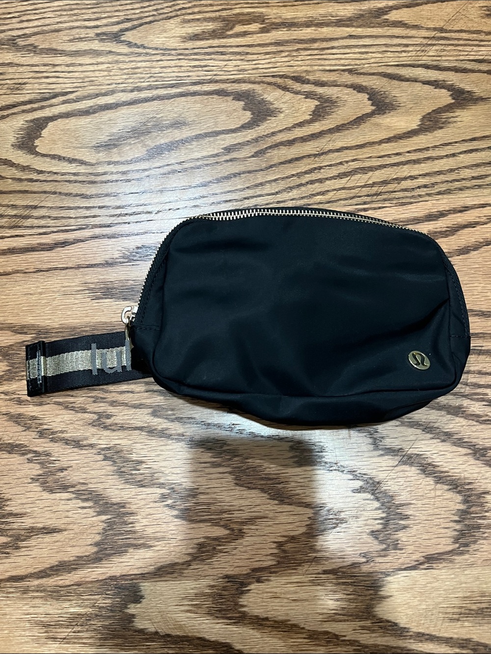 lululemon athletica Black Crossbody Belt Bag with gold striped Strap Detail